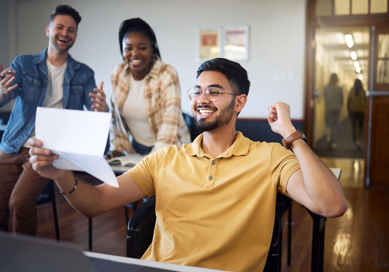 Happy student celebrating getting financial aid.